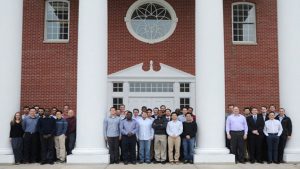 Group of people standing in front of a chrurch